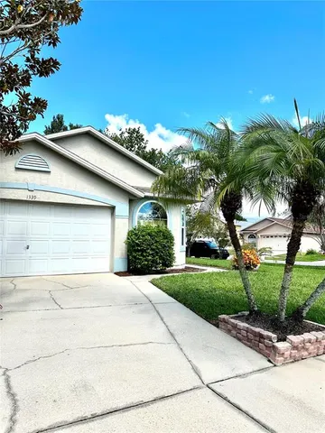 front view of a house with a garden