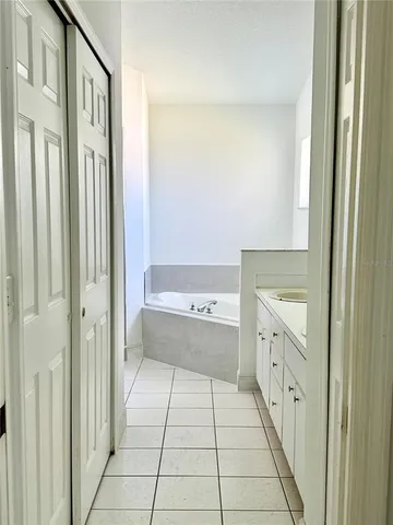 a bathroom with a bathtub and a sink