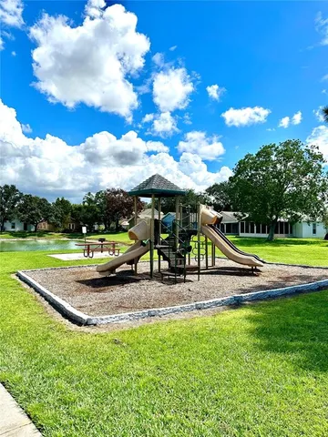 a view of a swimming pool with sitting area