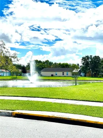 a view of a golf course with a lake