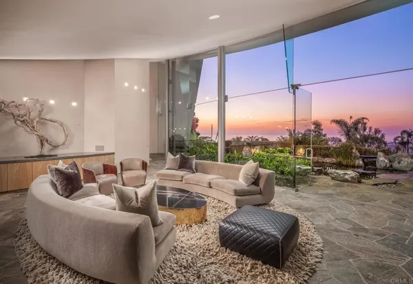 a view of a dining room with furniture water view and mountain view