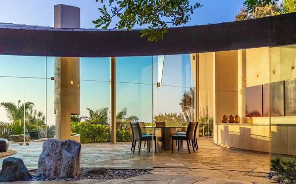 a view of a lake with a house in the background