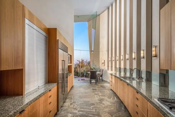 a bedroom with a bed and a view of bathroom