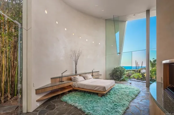 a view of a dining room with furniture and a potted plant