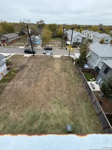 a view of a terrace with lawn chairs
