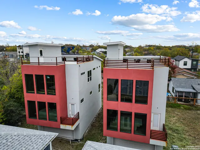 a view of a balcony with a barbeque