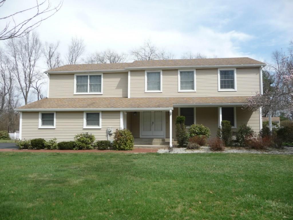 85 Abbe Road Enfield, CT 06082 - Photo 1 of 1 a front view of a house with garden and porch