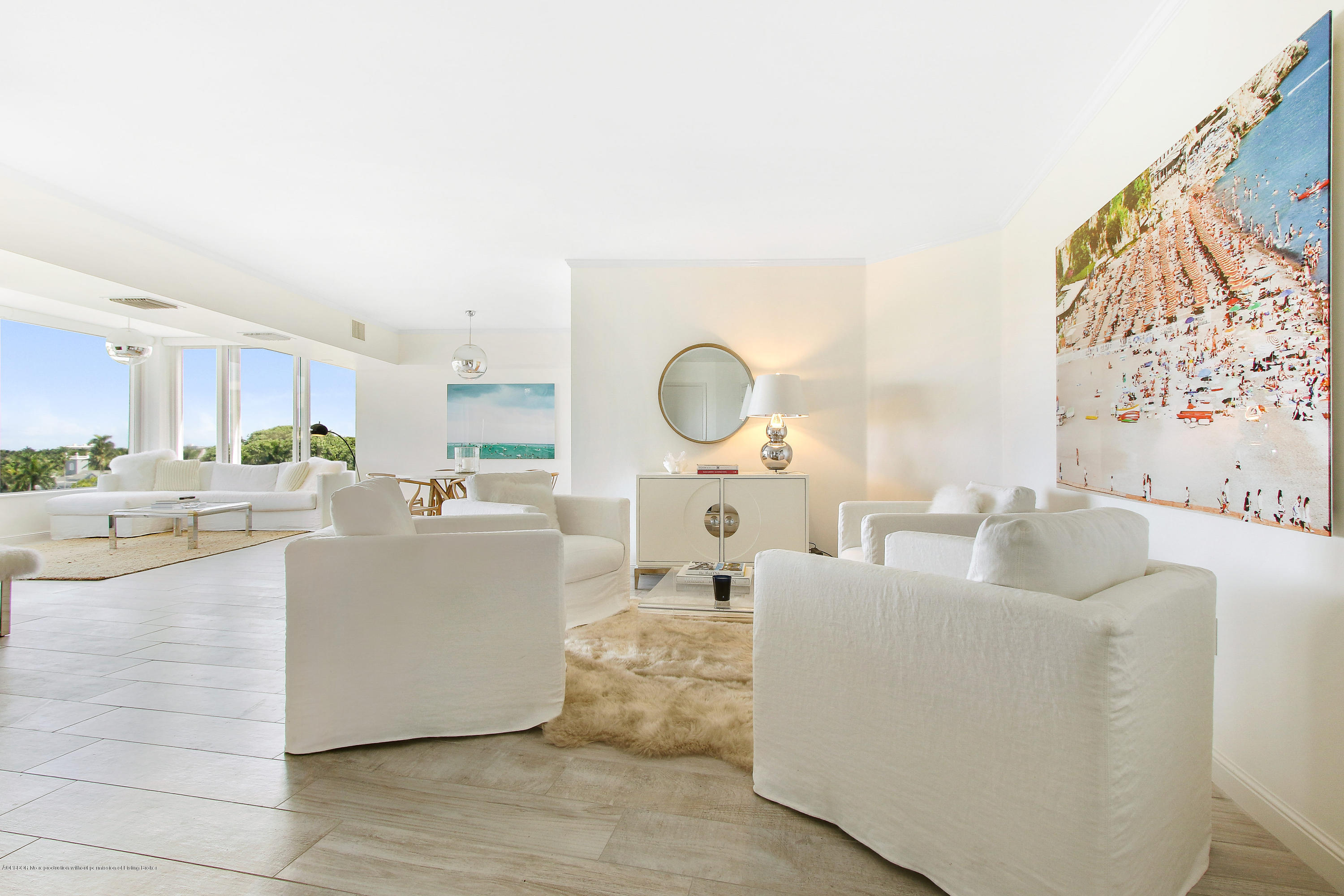 44 Cocoanut Row, Unit 522B Palm Beach, FL 33480 - Photo 1 of 15 a living room with couches a kitchen island with couches and chandelier