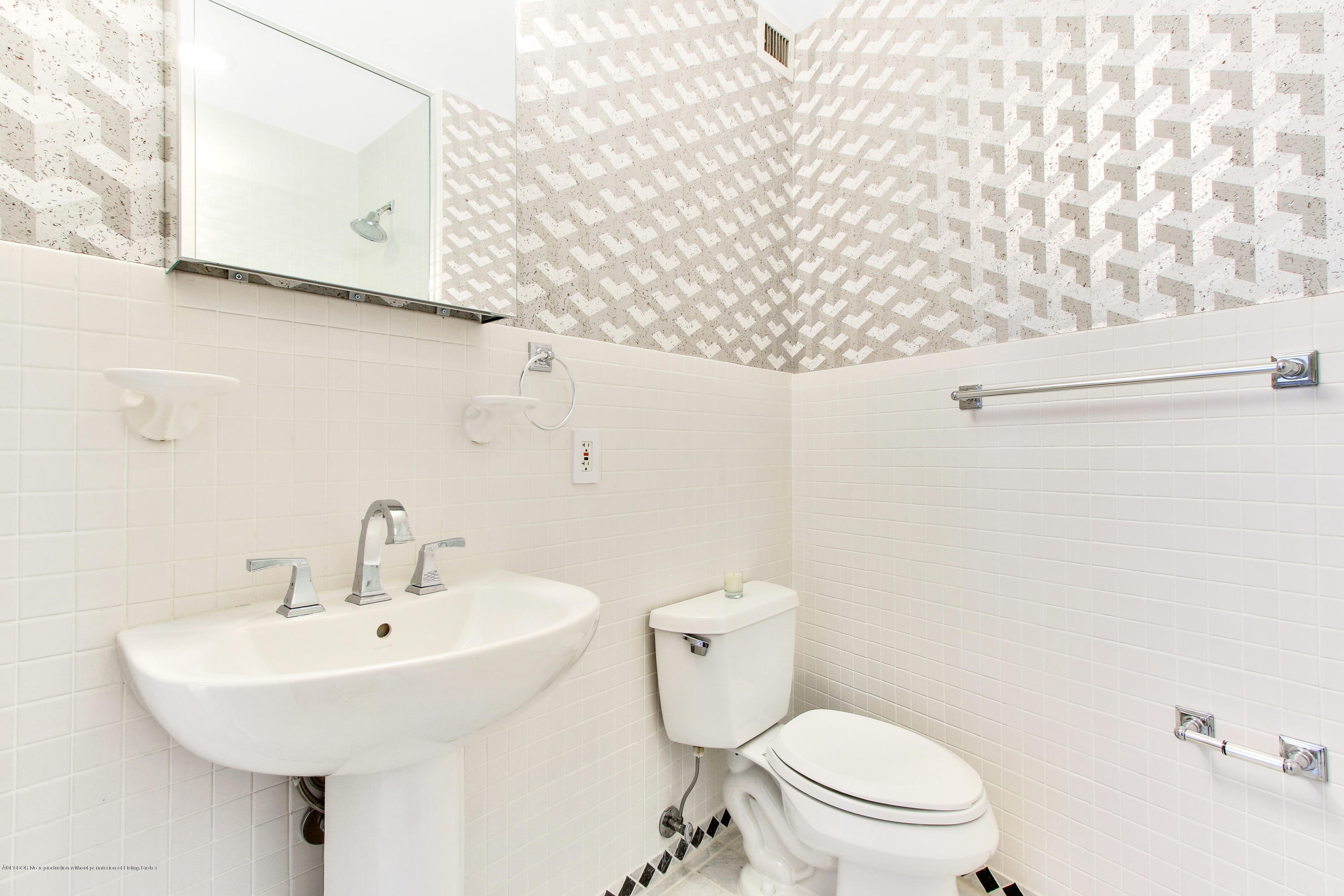 44 Cocoanut Row, Unit 522B Palm Beach, FL 33480 - Photo 13 of 15 a white toilet sitting next to a bathroom sink