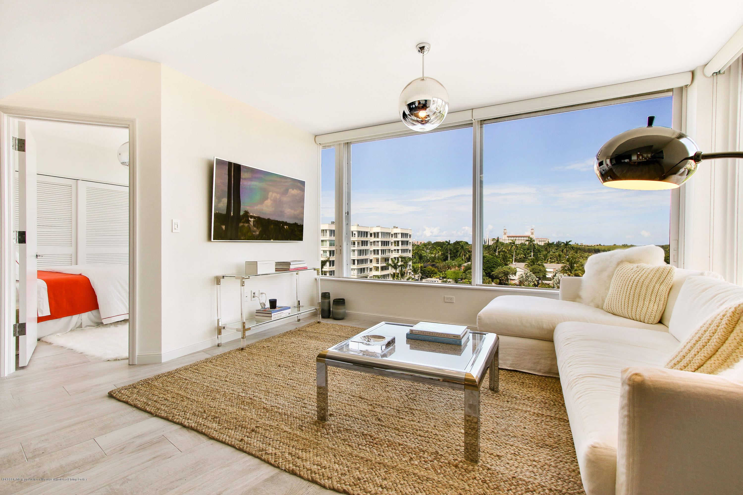 44 Cocoanut Row, Unit 522B Palm Beach, FL 33480 - Photo 5 of 15 a living room with furniture and a flat screen tv