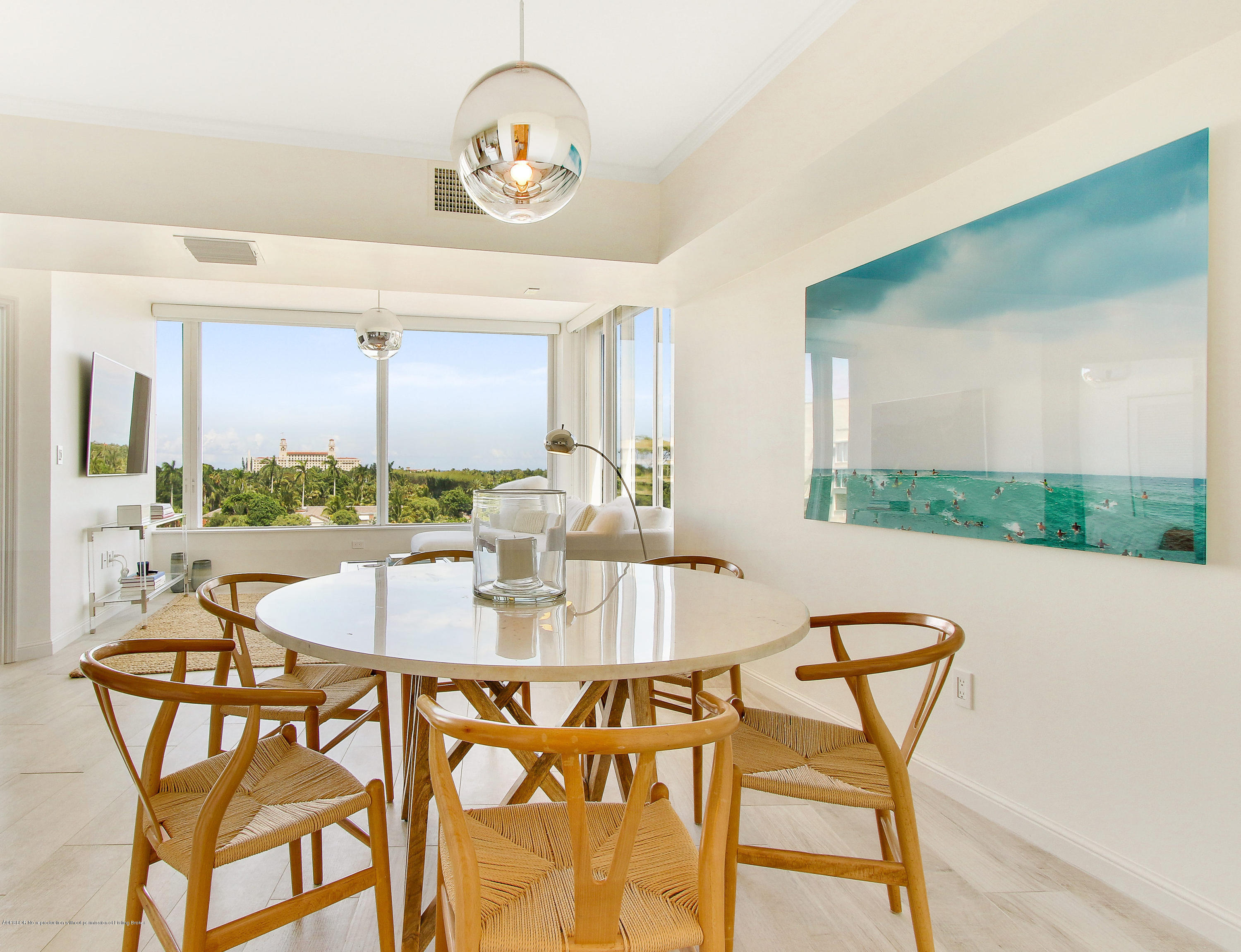 44 Cocoanut Row, Unit 522B Palm Beach, FL 33480 - Photo 6 of 15 a view of a dining room with furniture and wooden floor
