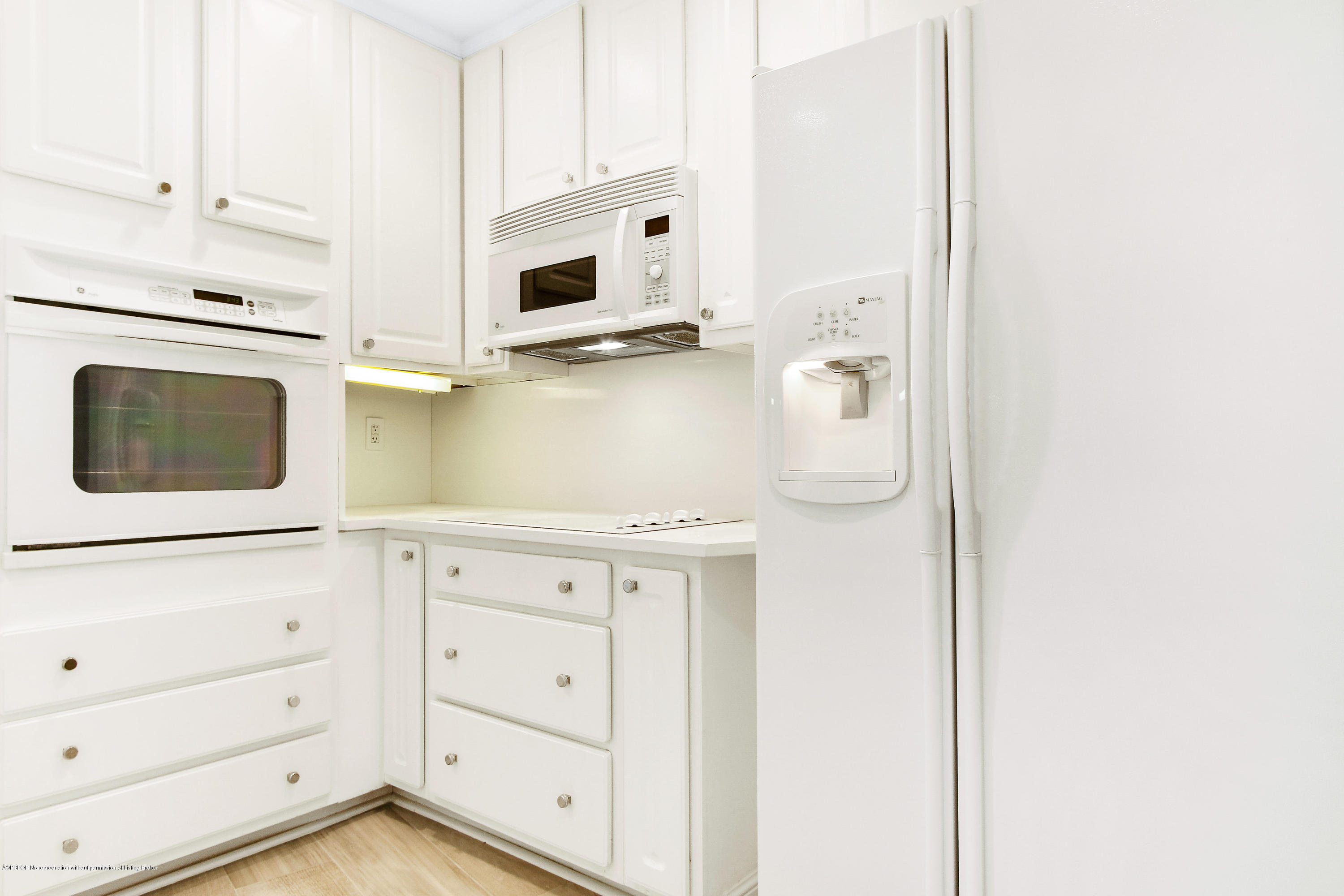 44 Cocoanut Row, Unit 522B Palm Beach, FL 33480 - Photo 8 of 15 a kitchen with stainless steel appliances white cabinets and a refrigerator