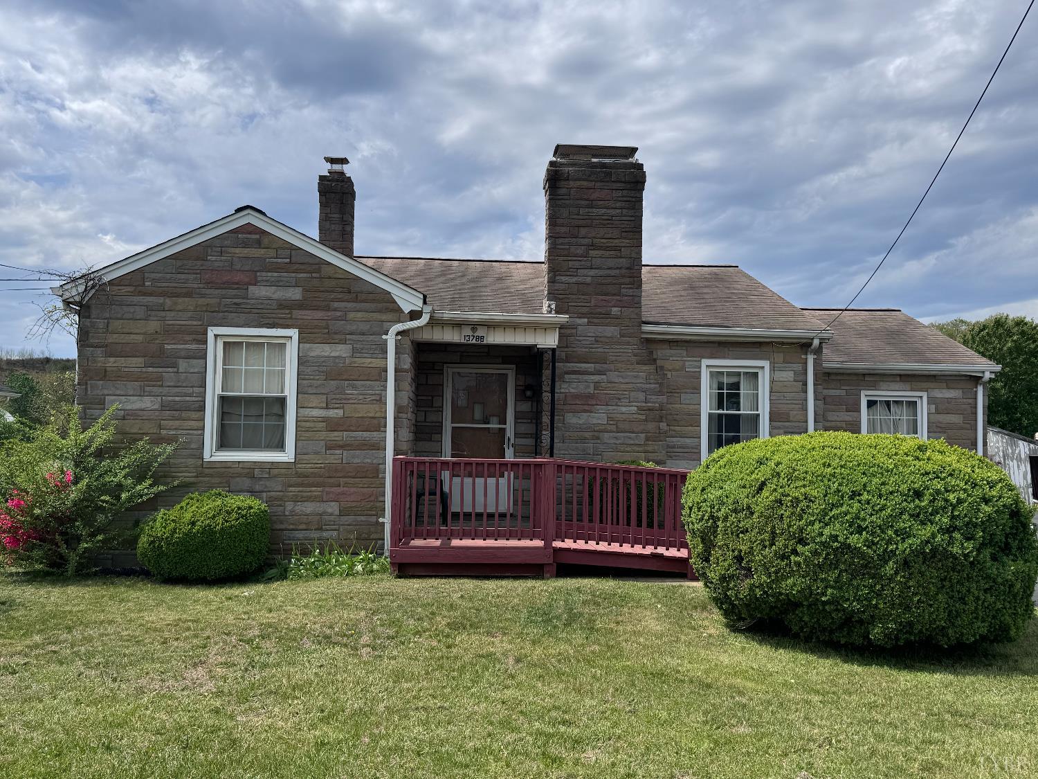 a front view of a house with garden
