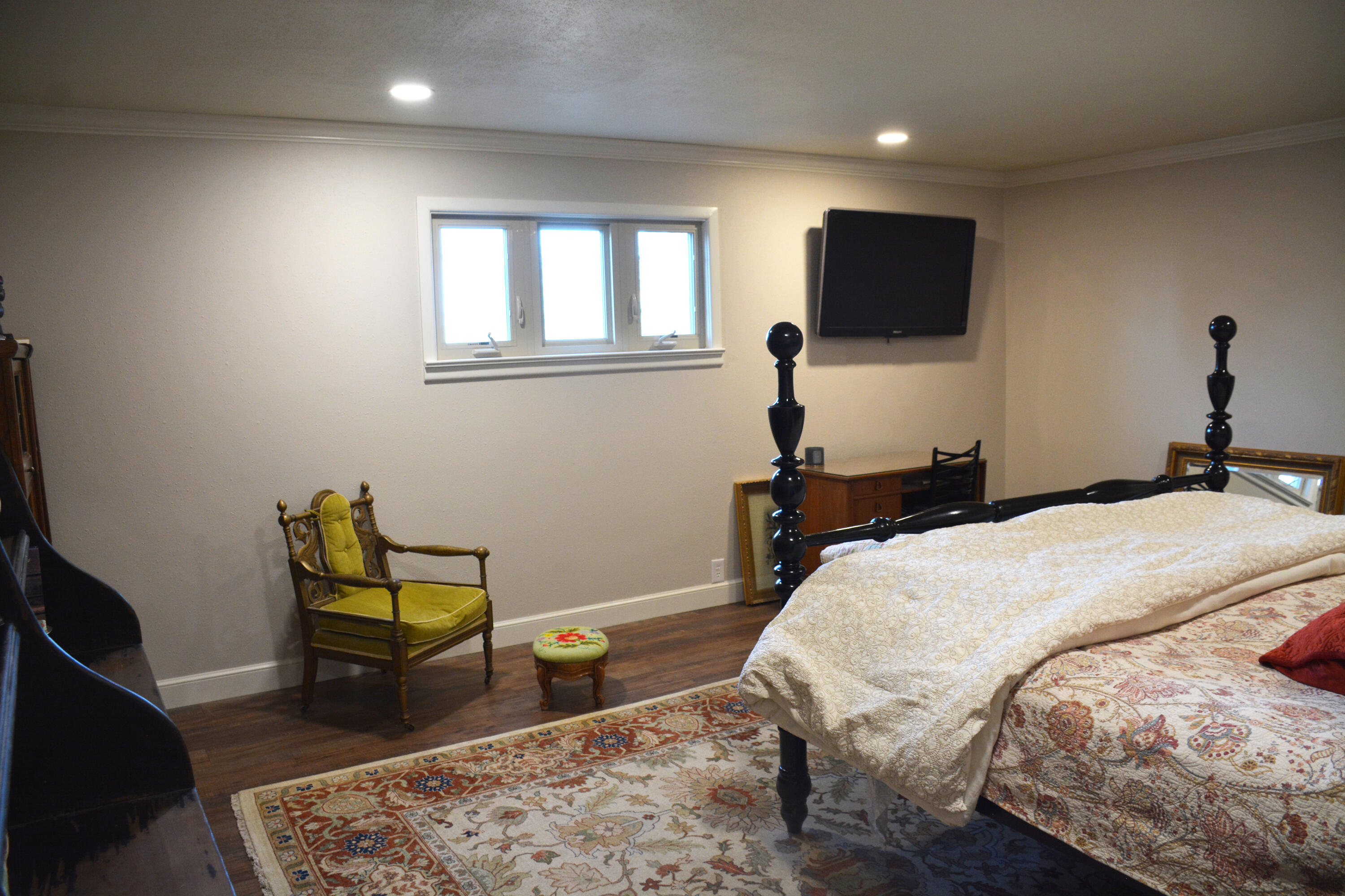 1907 Highway 70 Muleshoe, TX 79347 - Photo 26 of 34 a bedroom with a bed tv and chair