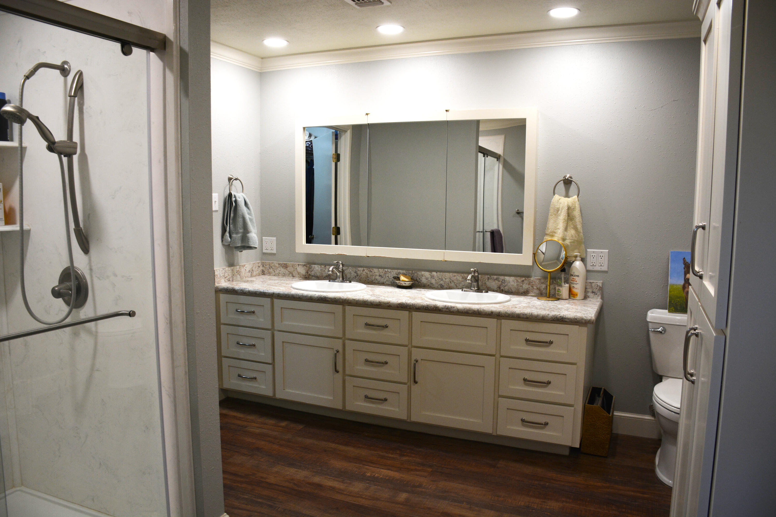 1907 Highway 70 Muleshoe, TX 79347 - Photo 28 of 34 a bathroom with a double vanity sink a and mirror