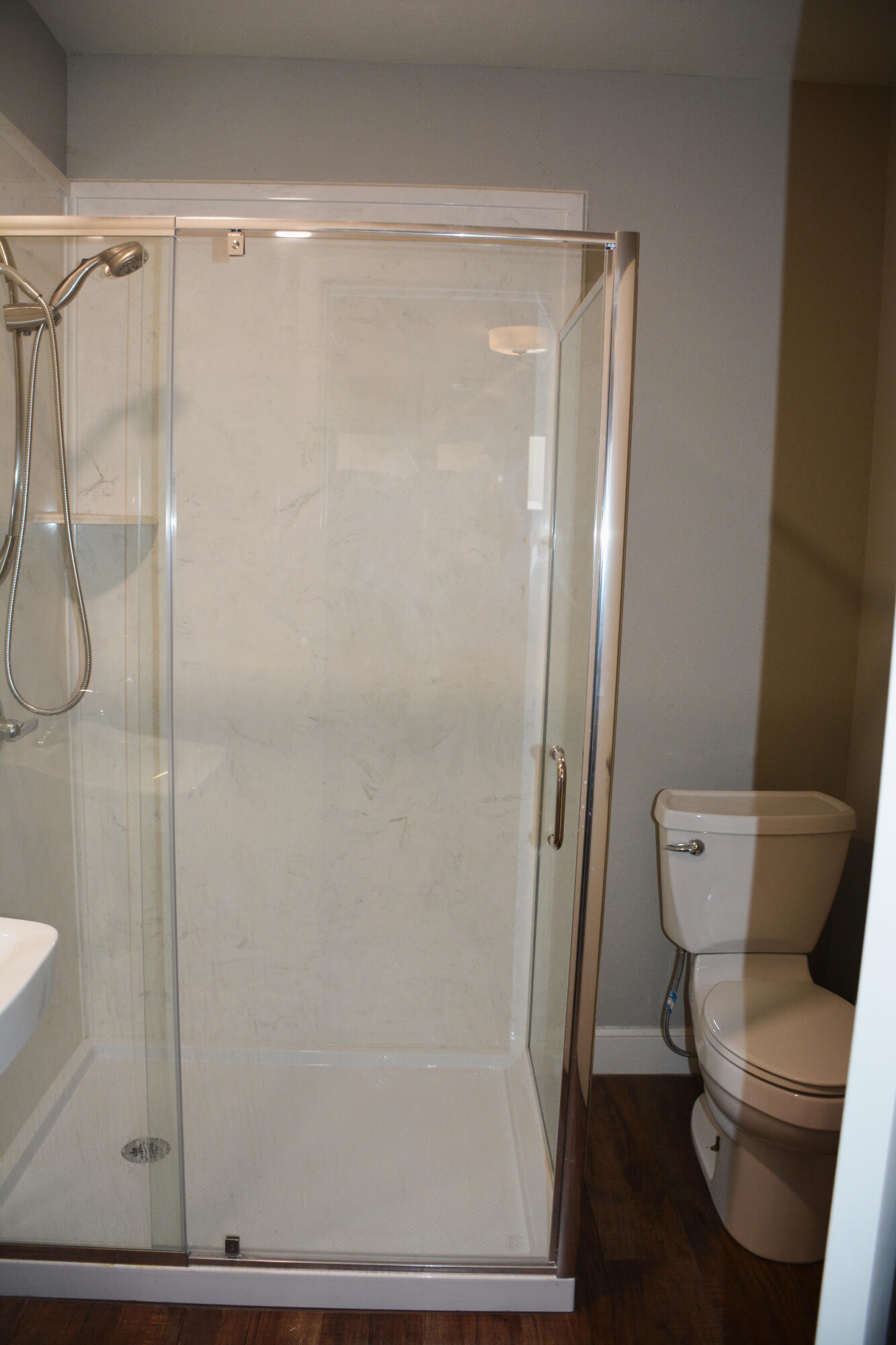 1907 Highway 70 Muleshoe, TX 79347 - Photo 34 of 34 a bathroom with a granite countertop toilet and a shower