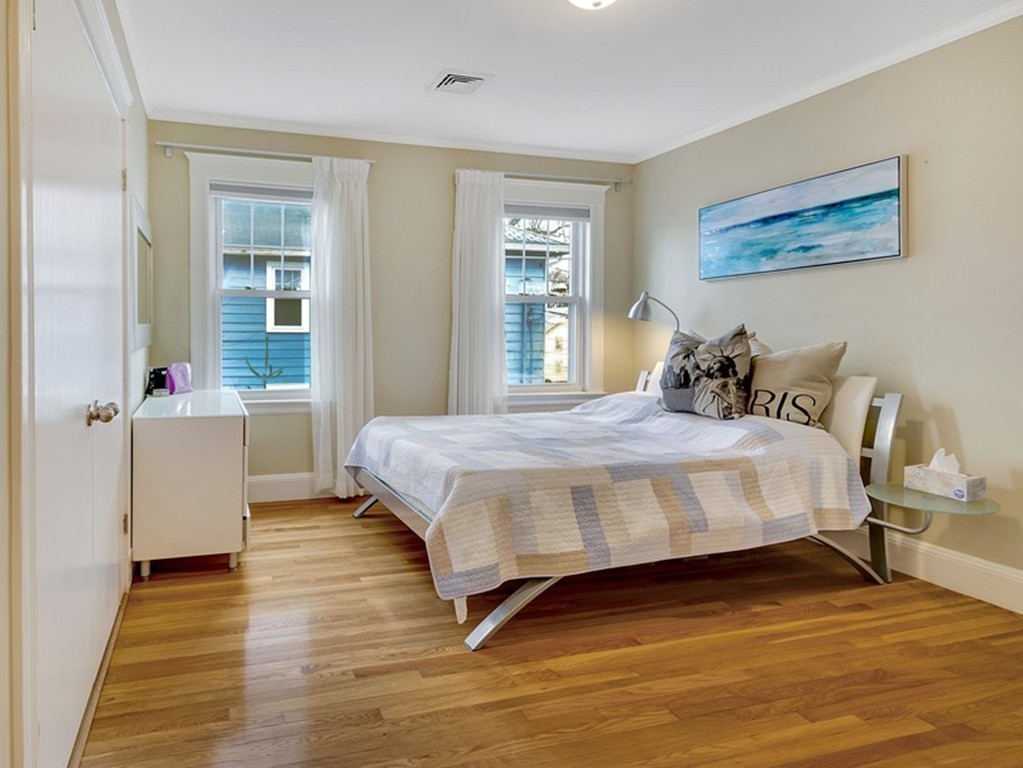 73 Athelstane Road, Unit 73 Newton, MA 02459 - Photo 8 of 20 a bedroom with a bed and wooden floor