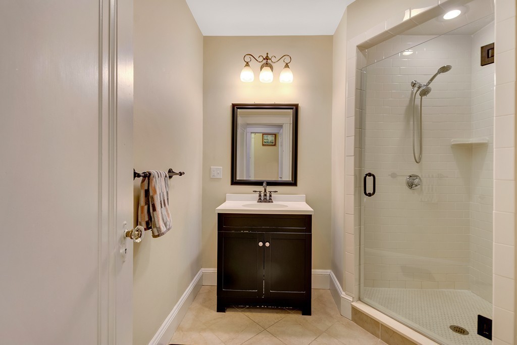73 Athelstane Road, Unit 73 Newton, MA 02459 - Photo 9 of 20 a bathroom with a sink and mirror