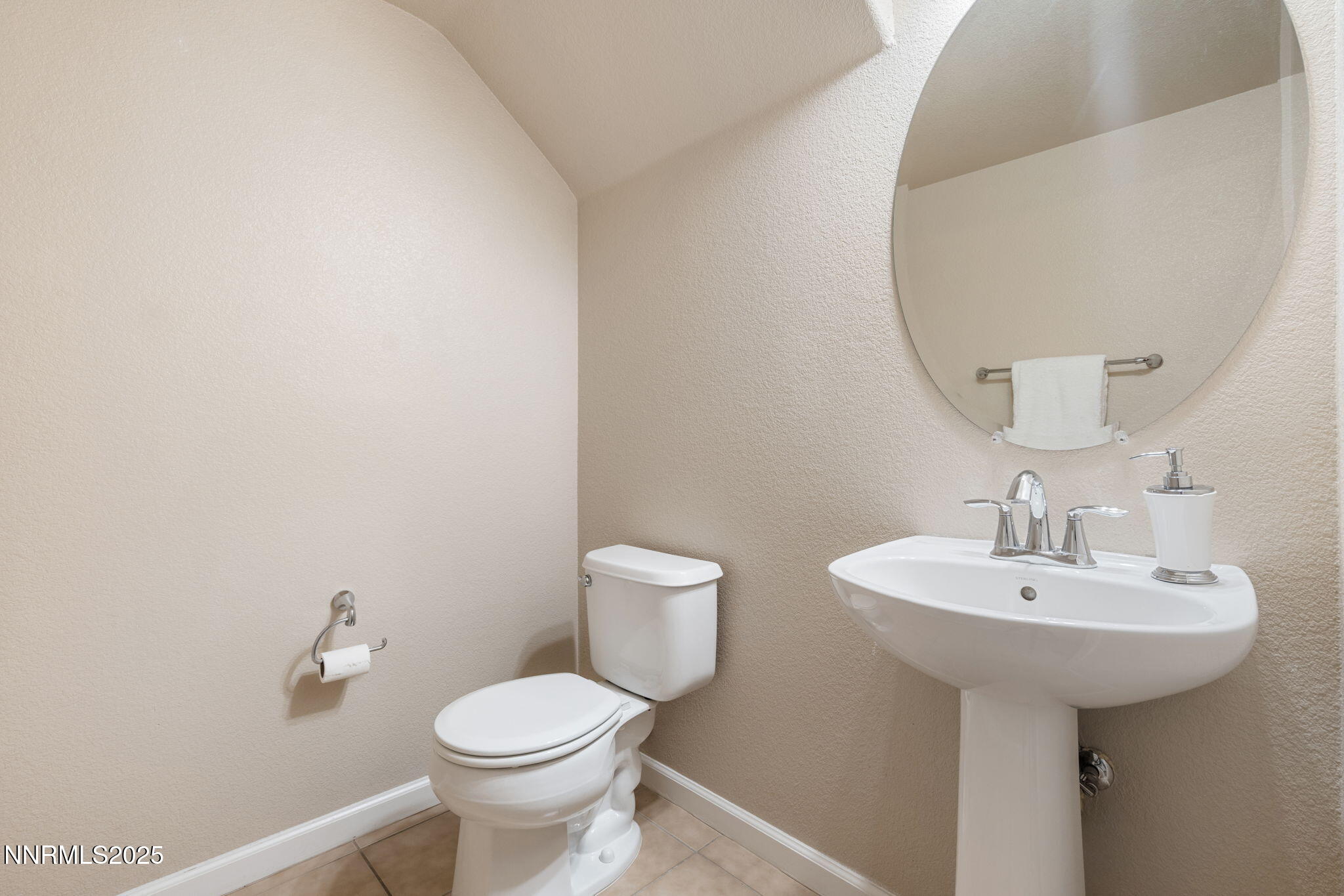 1865 Wind Ranch Road, Unit A Reno, NV 89521 - Photo 15 of 30 a bathroom with a sink toilet and a mirror