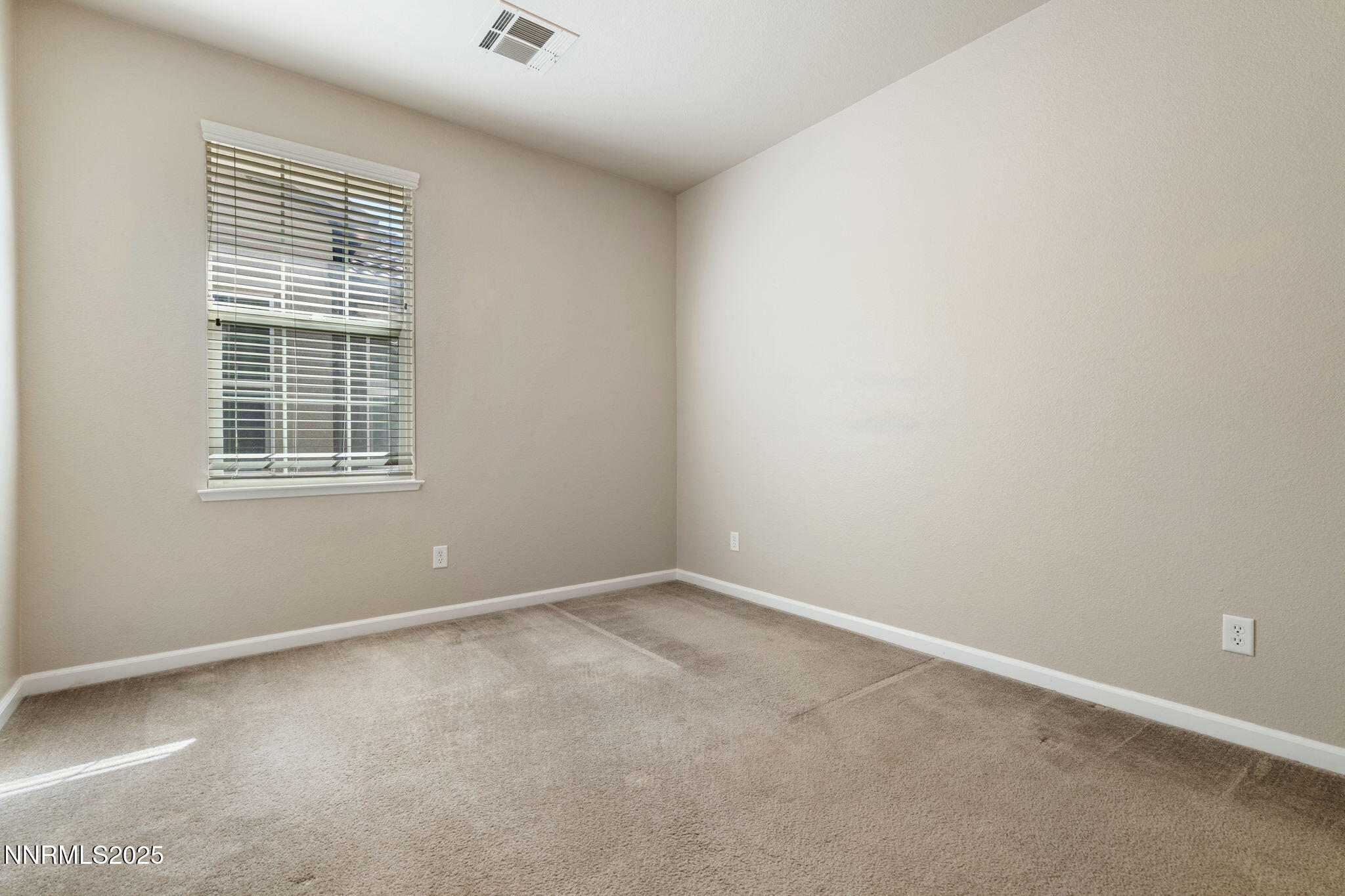 1865 Wind Ranch Road, Unit A Reno, NV 89521 - Photo 20 of 30 an empty room with a window