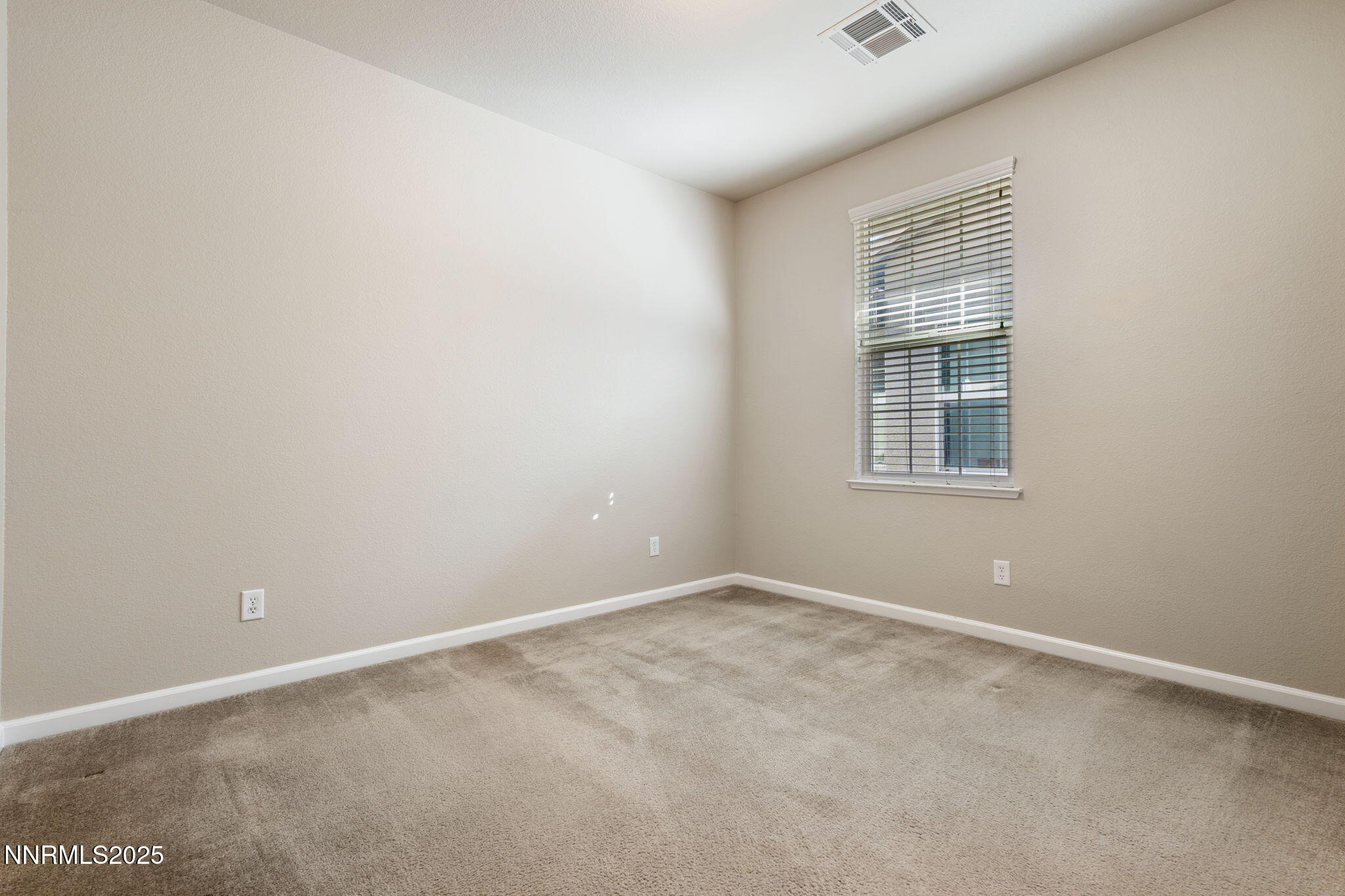 1865 Wind Ranch Road, Unit A Reno, NV 89521 - Photo 21 of 30 an empty room with windows