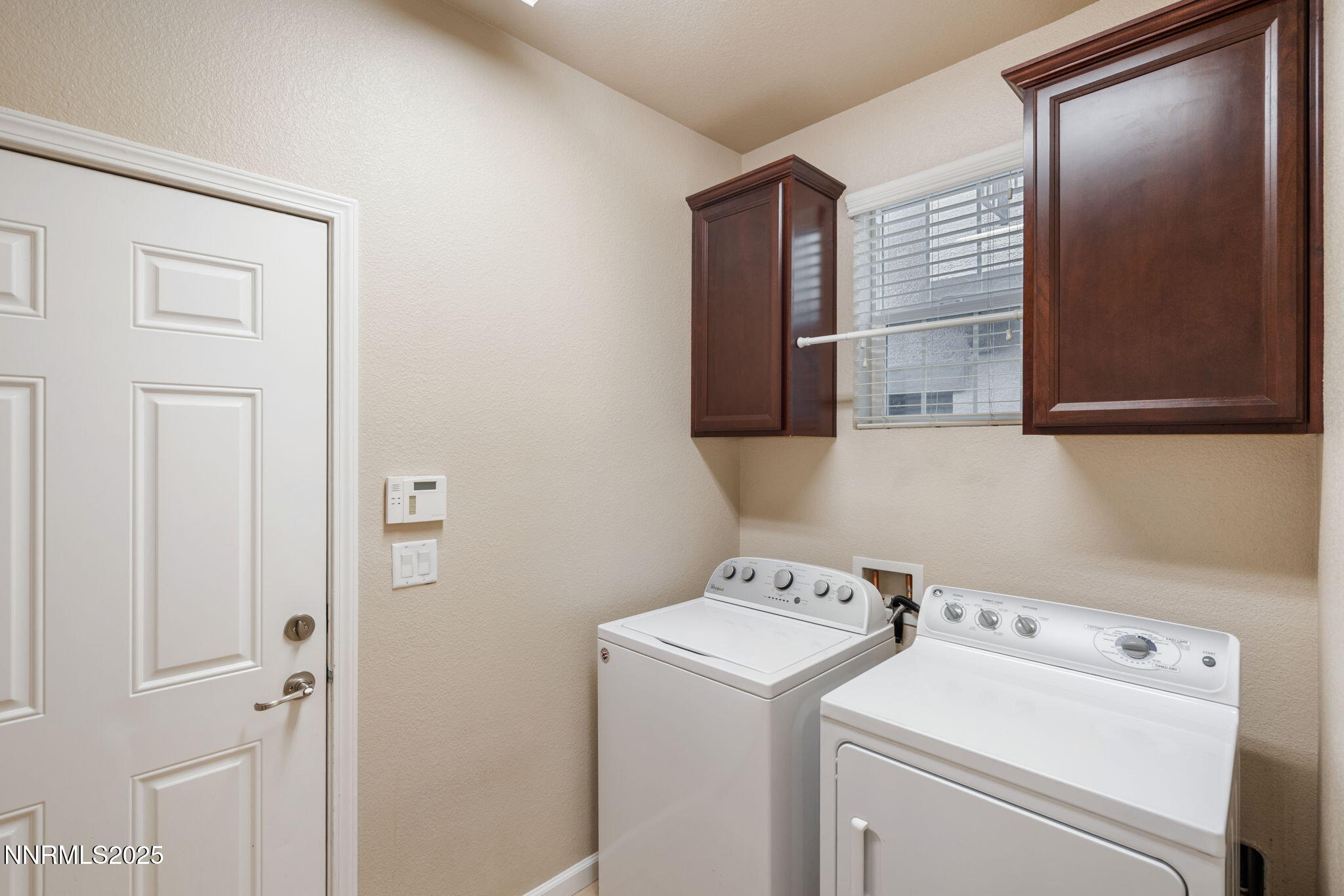 1865 Wind Ranch Road, Unit A Reno, NV 89521 - Photo 23 of 30 a view of storage and utility room with washer and dryer