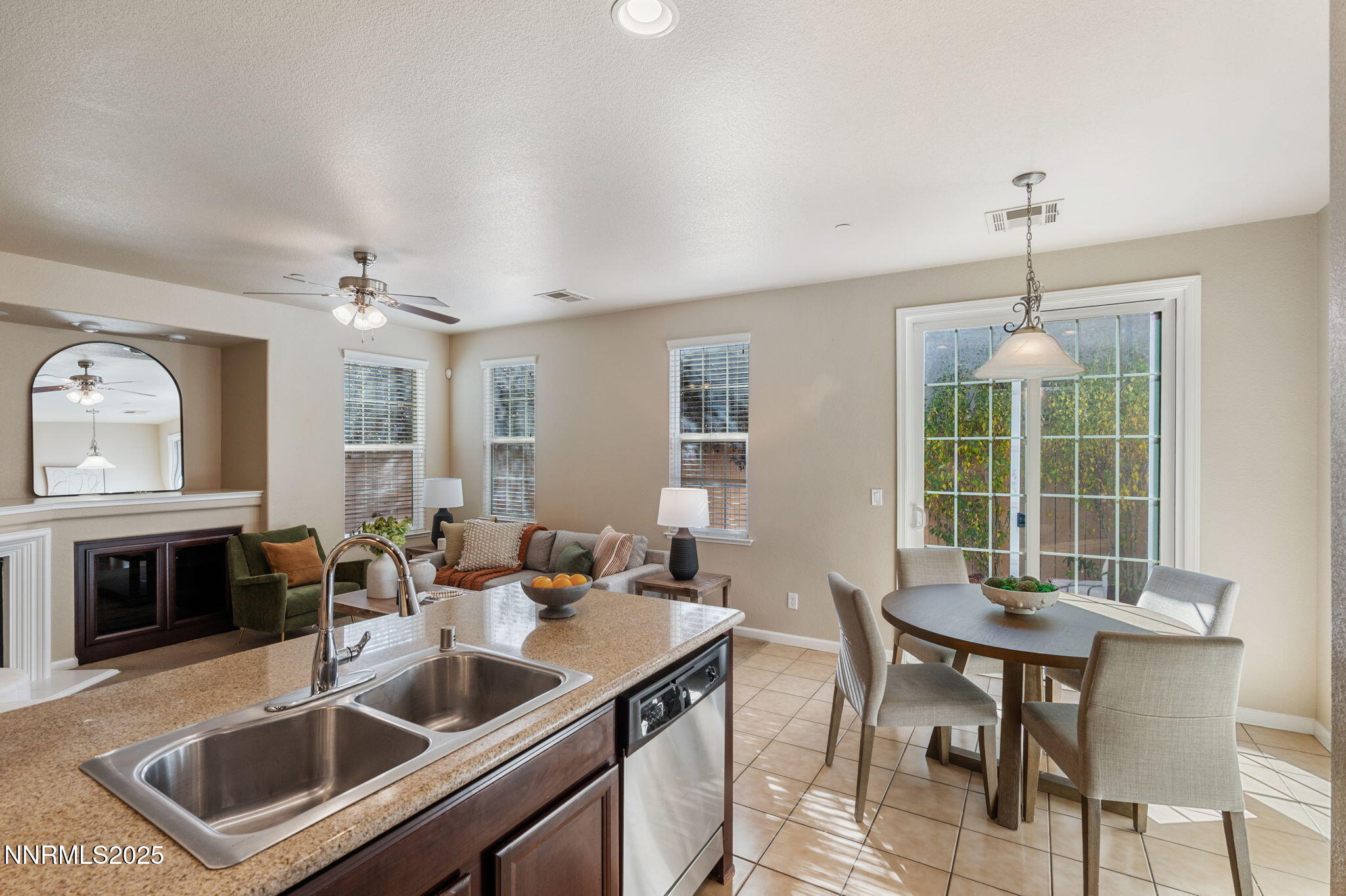 1865 Wind Ranch Road, Unit A Reno, NV 89521 - Photo 4 of 30 a kitchen with a stove a sink and a refrigerator