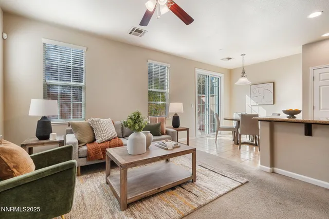 a living room with furniture and windows