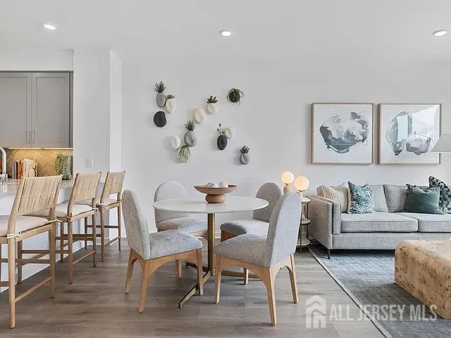 a view of a dining room with furniture and wooden floor