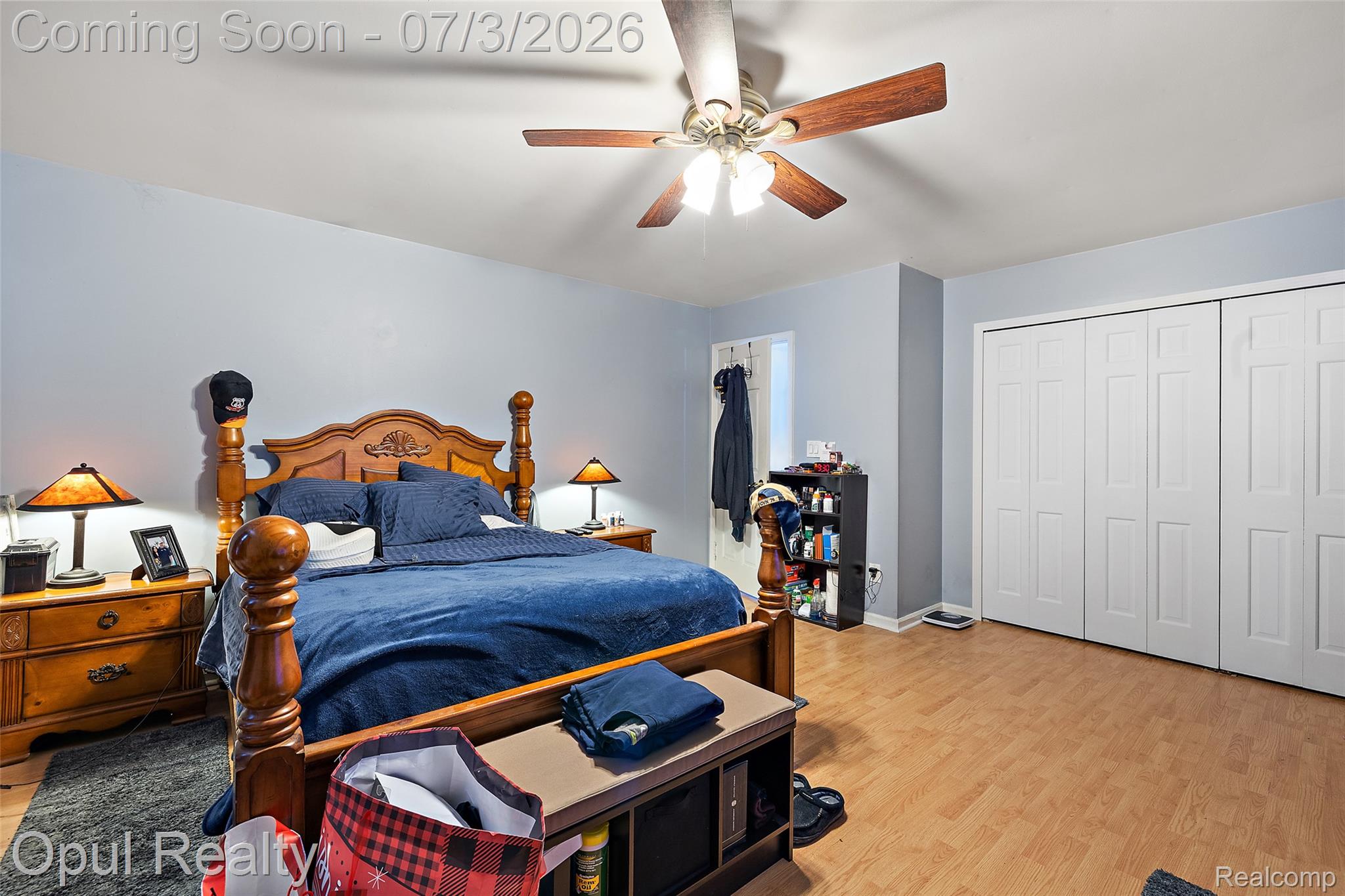 8855 Gross Road Dexter, MI 48130 - Photo 50 of 53 Spacious bedroom featuring light blue walls and wood-finish flooring
