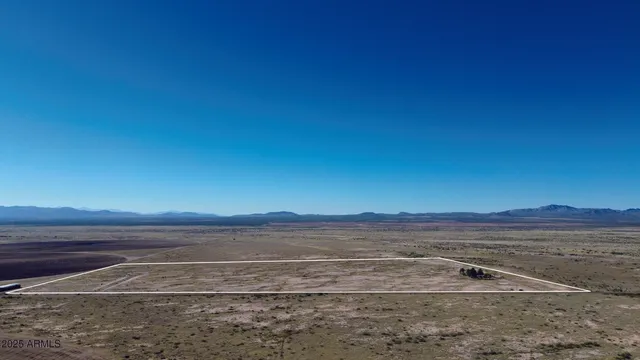 an aerial view of residential building and ocean