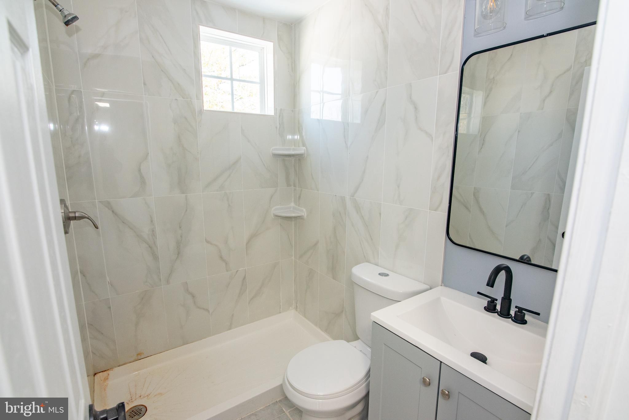 2900 Scherer Avenue Baltimore, MD 21234 - Photo 12 of 37 a bathroom with a sink toilet and shower
