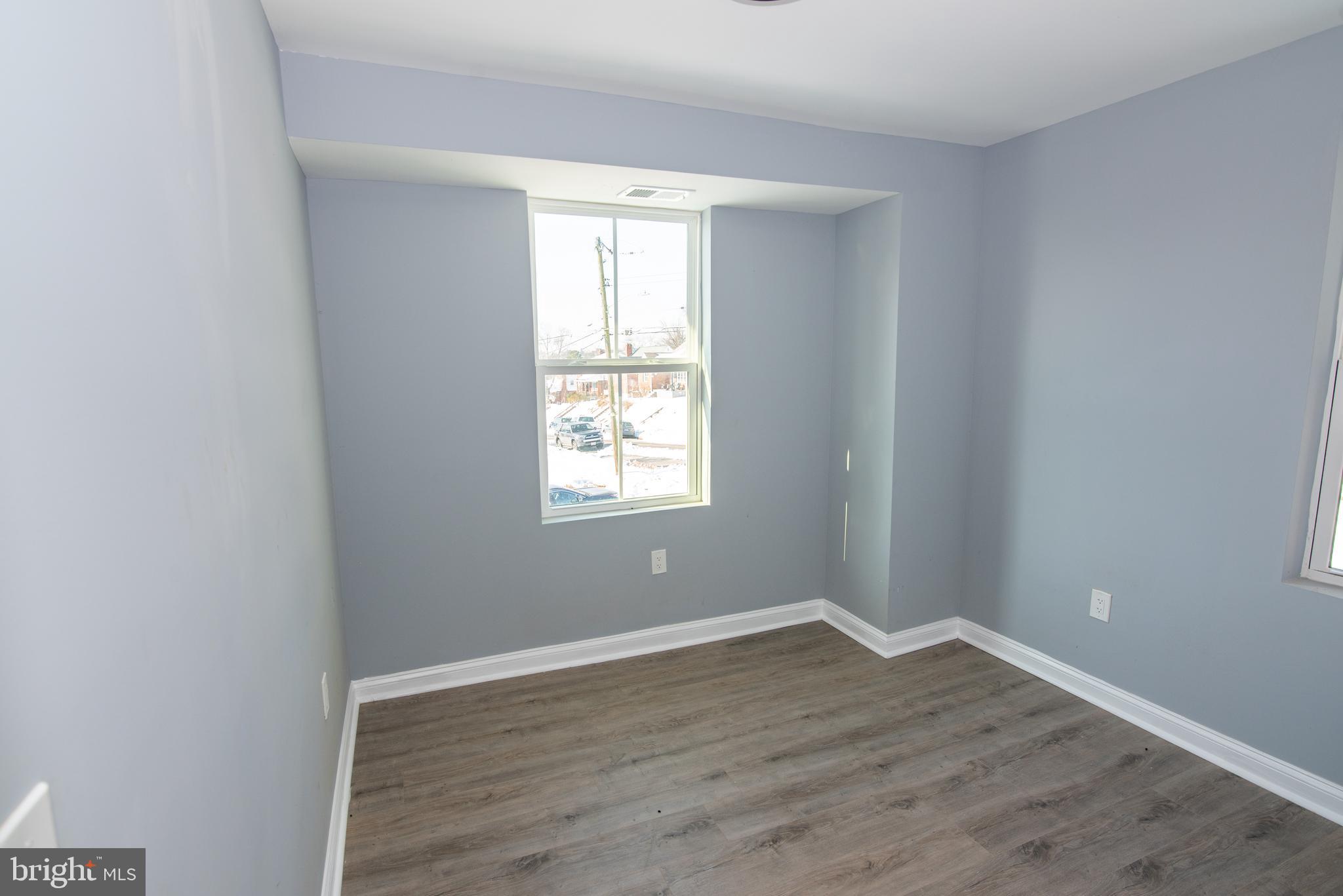 2900 Scherer Avenue Baltimore, MD 21234 - Photo 15 of 37 wooden floor in an empty room with a window