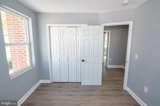 a view of entryway with wooden floor