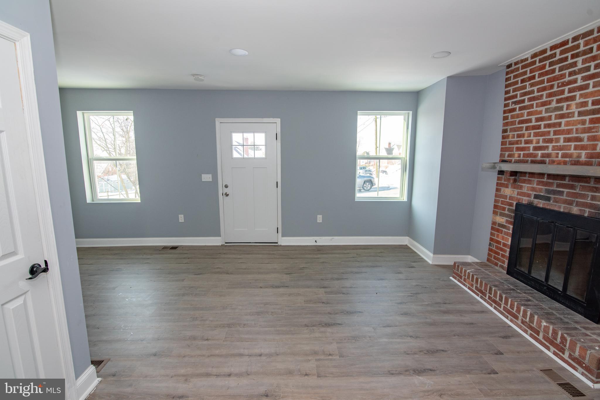 2900 Scherer Avenue Baltimore, MD 21234 - Photo 3 of 37 a view of an empty room with wooden floor and a window