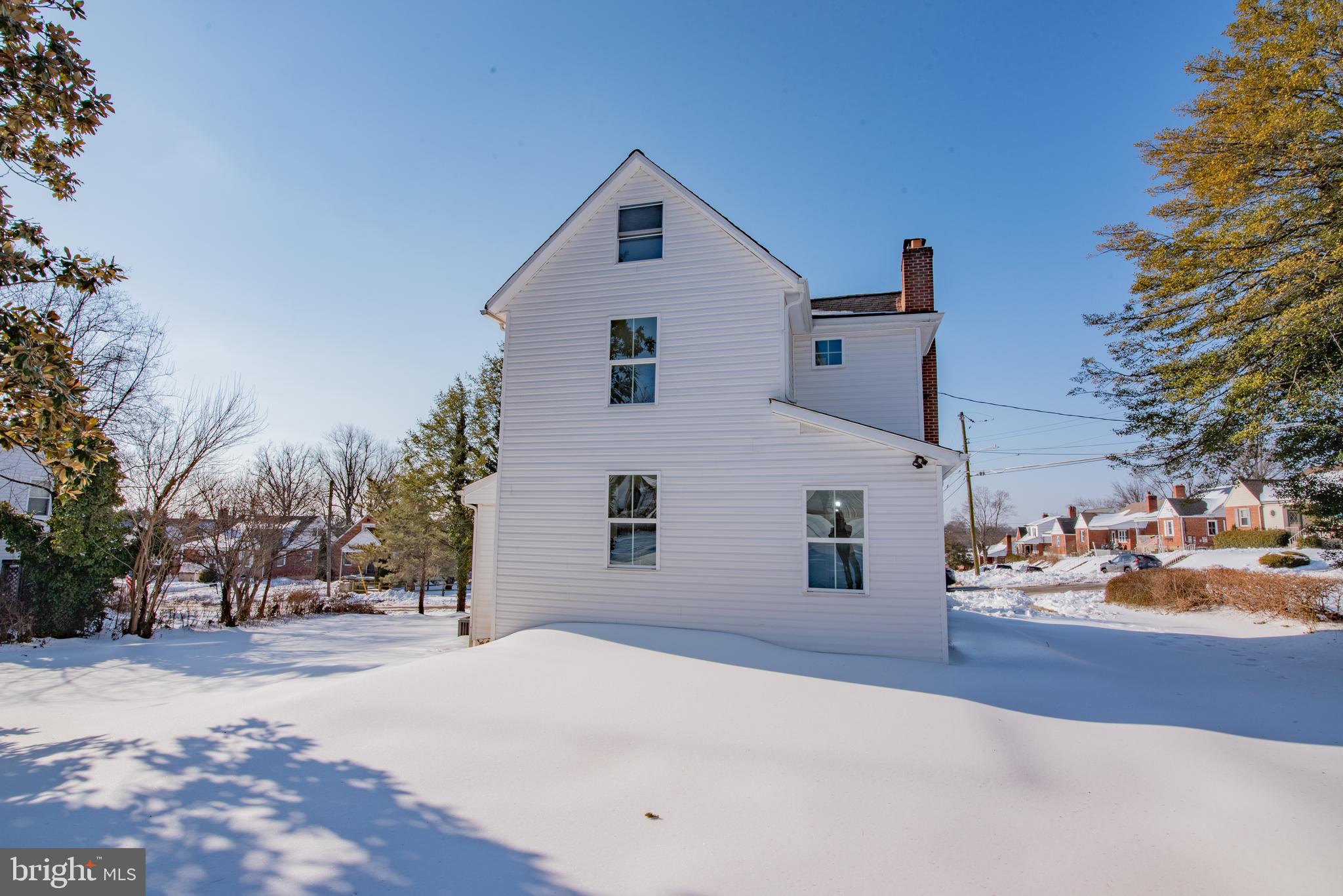 2900 Scherer Avenue Baltimore, MD 21234 - Photo 31 of 37 a front view of a house with a snow on the road