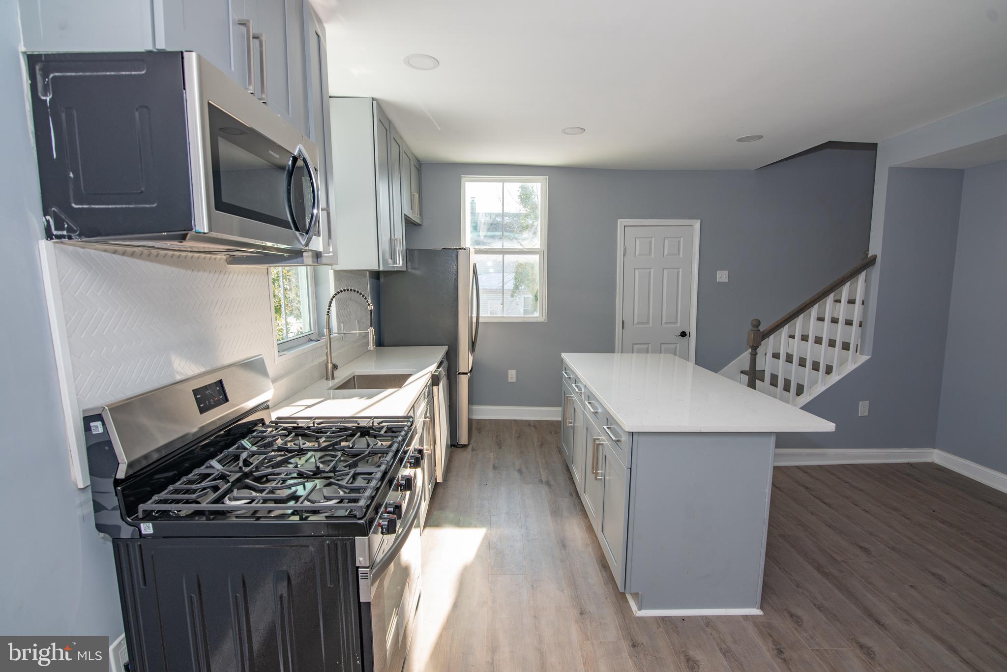 2900 Scherer Avenue Baltimore, MD 21234 - Photo 6 of 37 a kitchen with a stove and a refrigerator