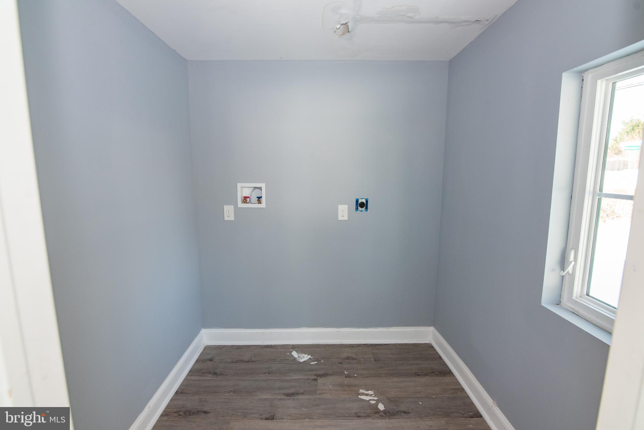 2900 Scherer Avenue Baltimore, MD 21234 - Photo 9 of 37 a view of a small space with wooden floor and a window
