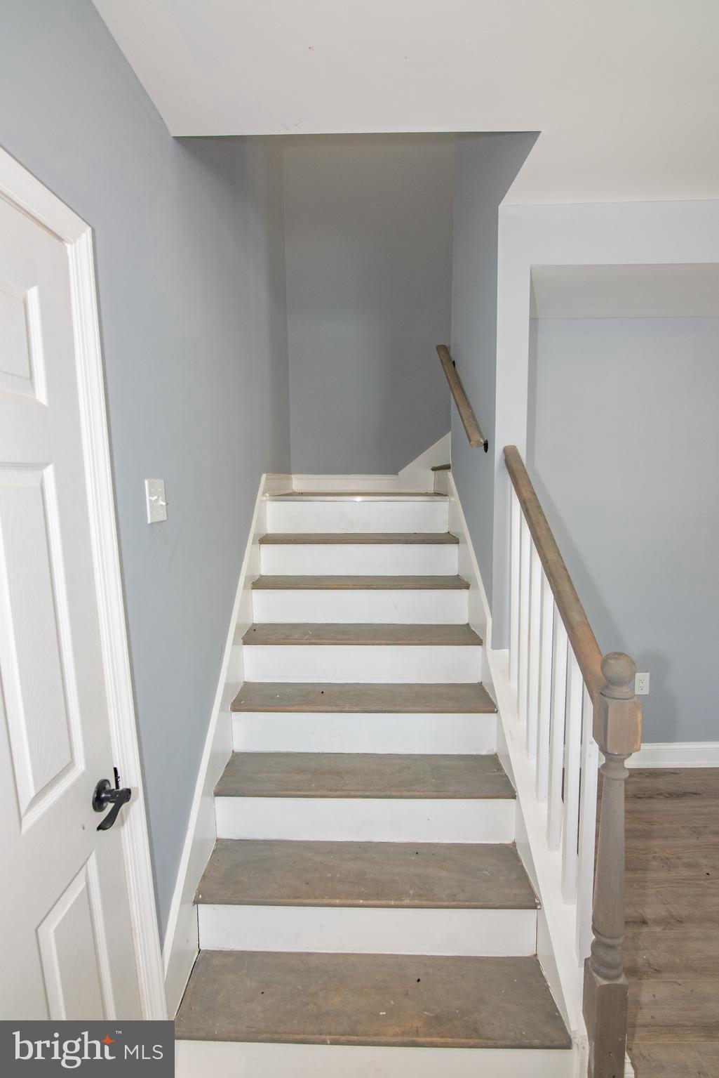 2900 Scherer Avenue Baltimore, MD 21234 - Photo 10 of 37 a view of staircase with wooden floor and white walls