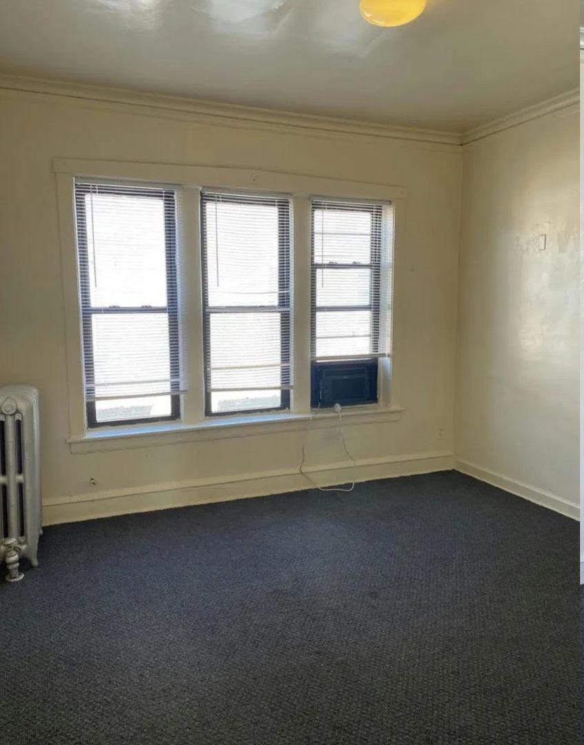 3320 West 67th Street, Unit 3N Chicago, IL 60629 - Photo 4 of 9 an empty room with a window