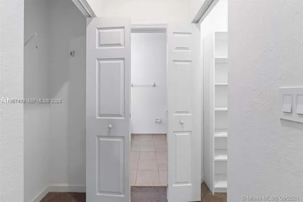 a bathroom with a shower a toilet and a sink