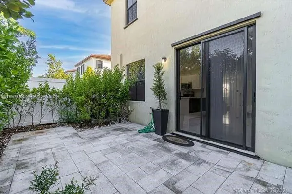 a aerial view of a house with garden space and sitting area