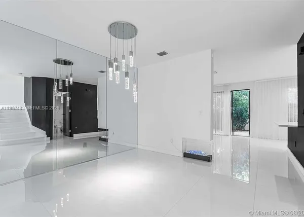 a bathroom with a sink a shower and a mirror