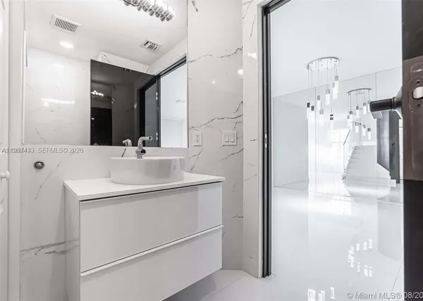 a kitchen with stainless steel appliances a refrigerator and a microwave