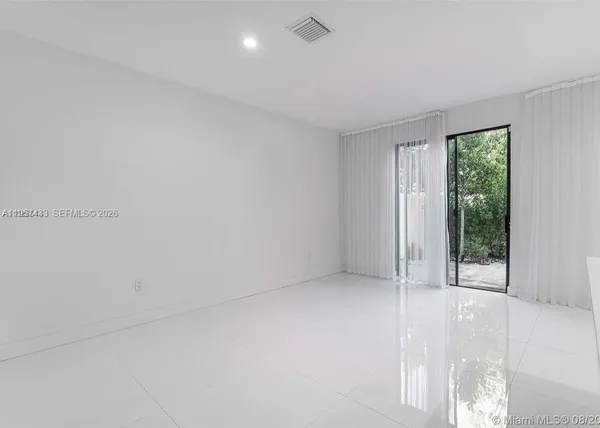 a kitchen with stainless steel appliances granite countertop a sink and a stove