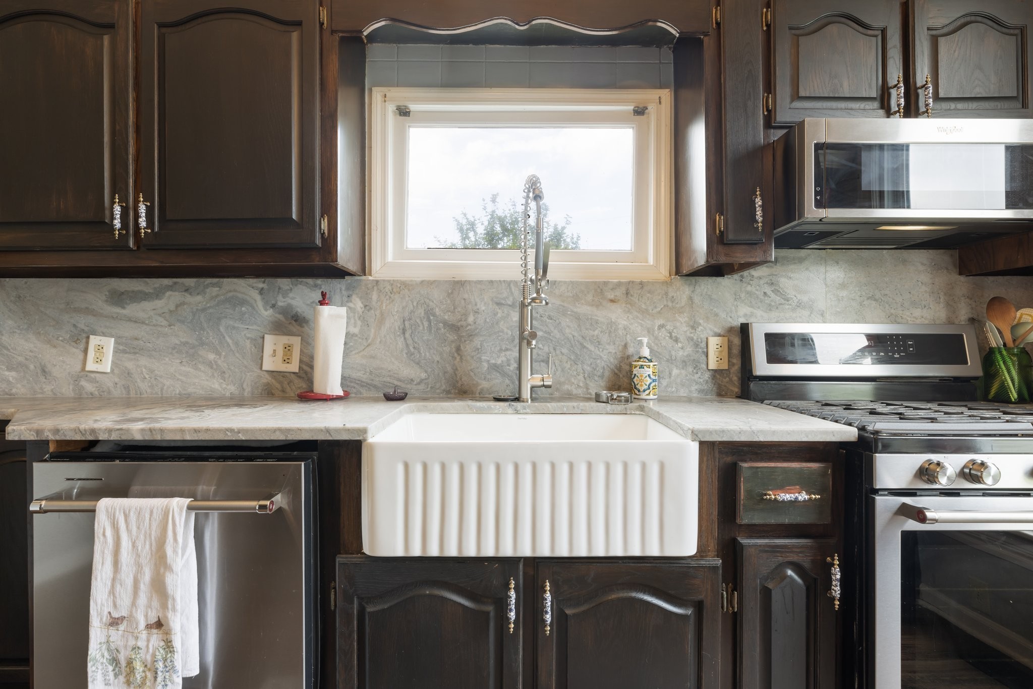 3310 Booker Ridge Road Mount Pleasant, TN 38474 - Photo 12 of 40 a kitchen with stainless steel appliances granite countertop a stove a sink and a microwave