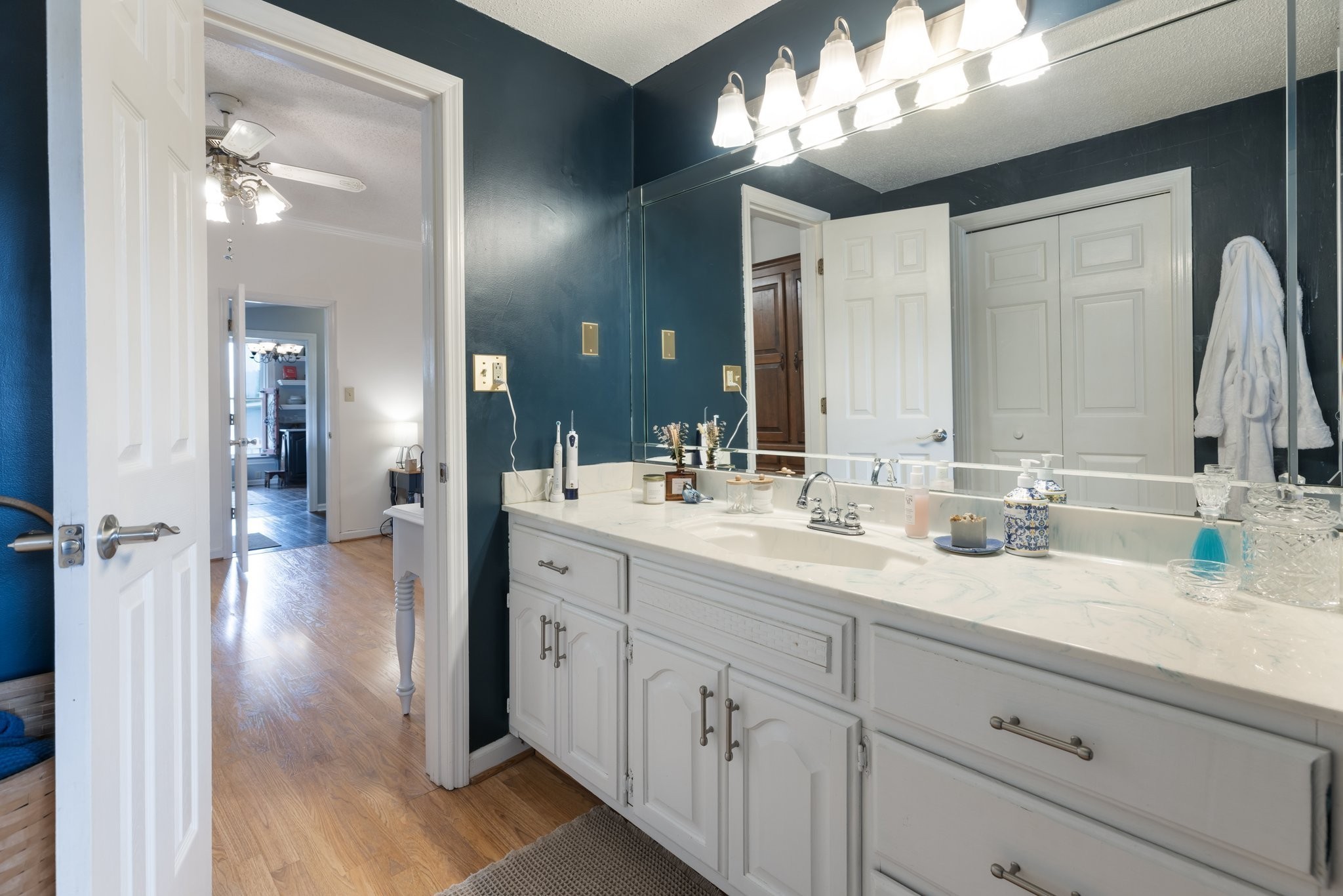 3310 Booker Ridge Road Mount Pleasant, TN 38474 - Photo 16 of 40 a bathroom with a double vanity sink and a mirror