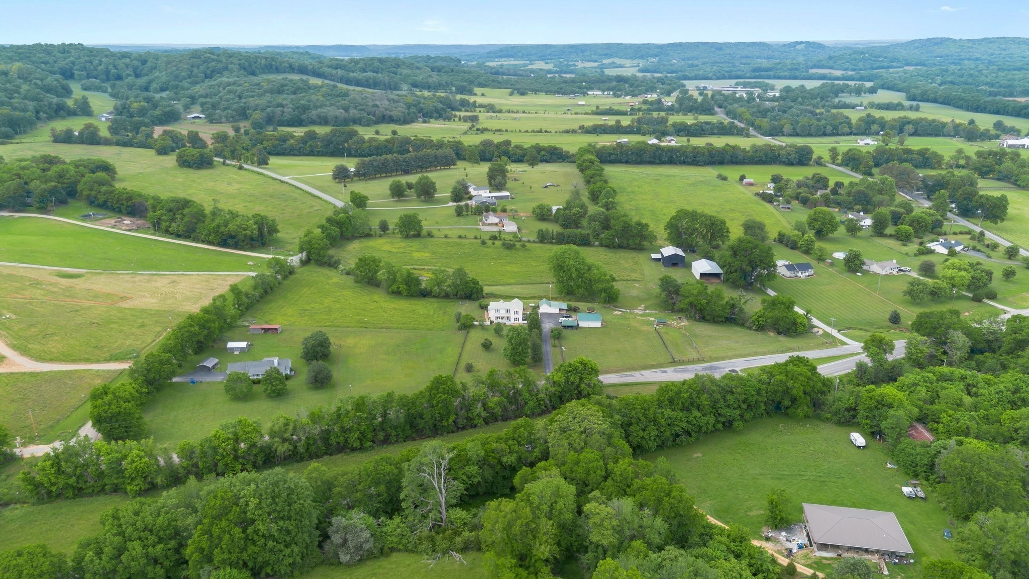3310 Booker Ridge Road Mount Pleasant, TN 38474 - Photo 18 of 40 an aerial view of huge green field with lots of green bushes