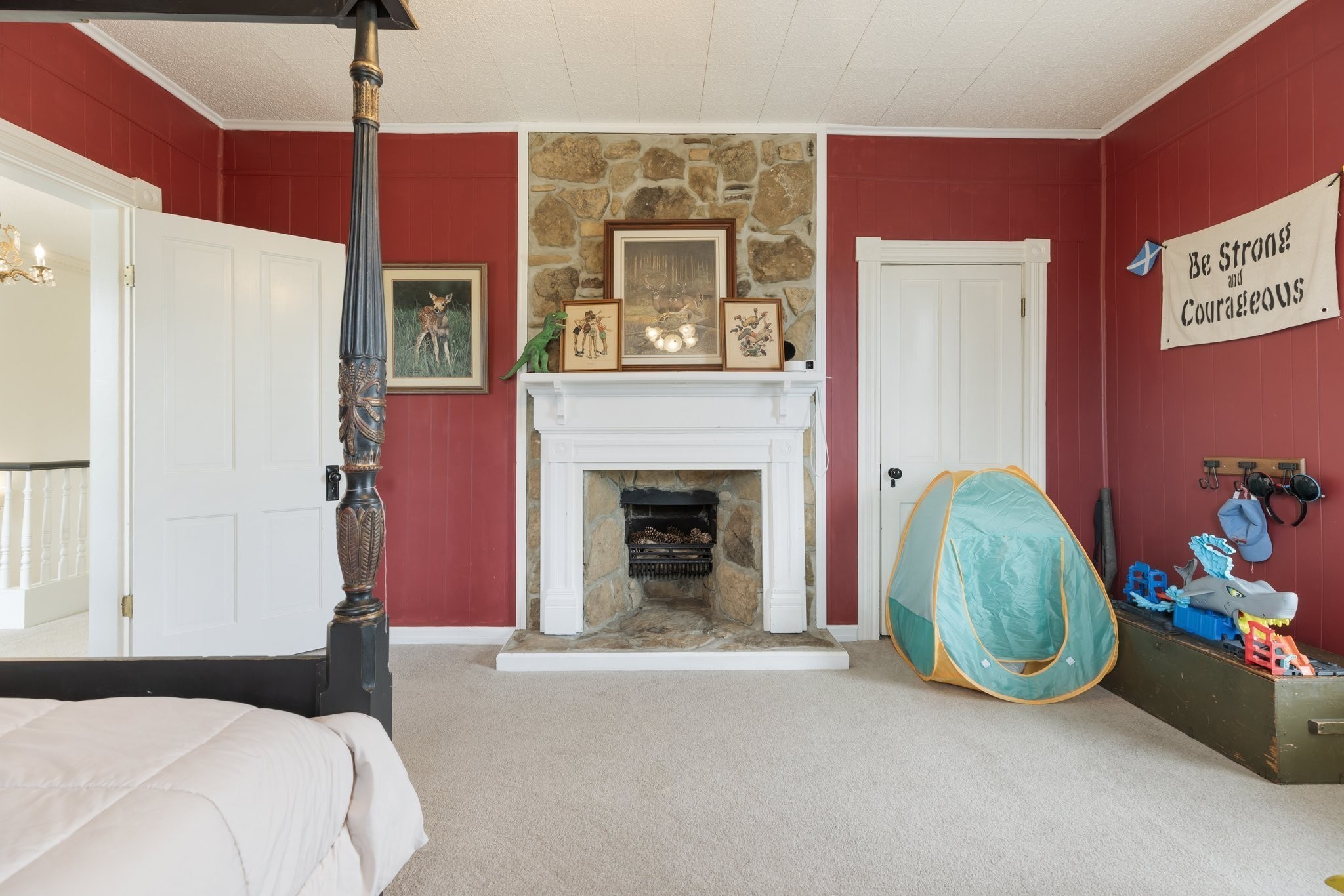 3310 Booker Ridge Road Mount Pleasant, TN 38474 - Photo 27 of 40 a bedroom with a bed and a fireplace