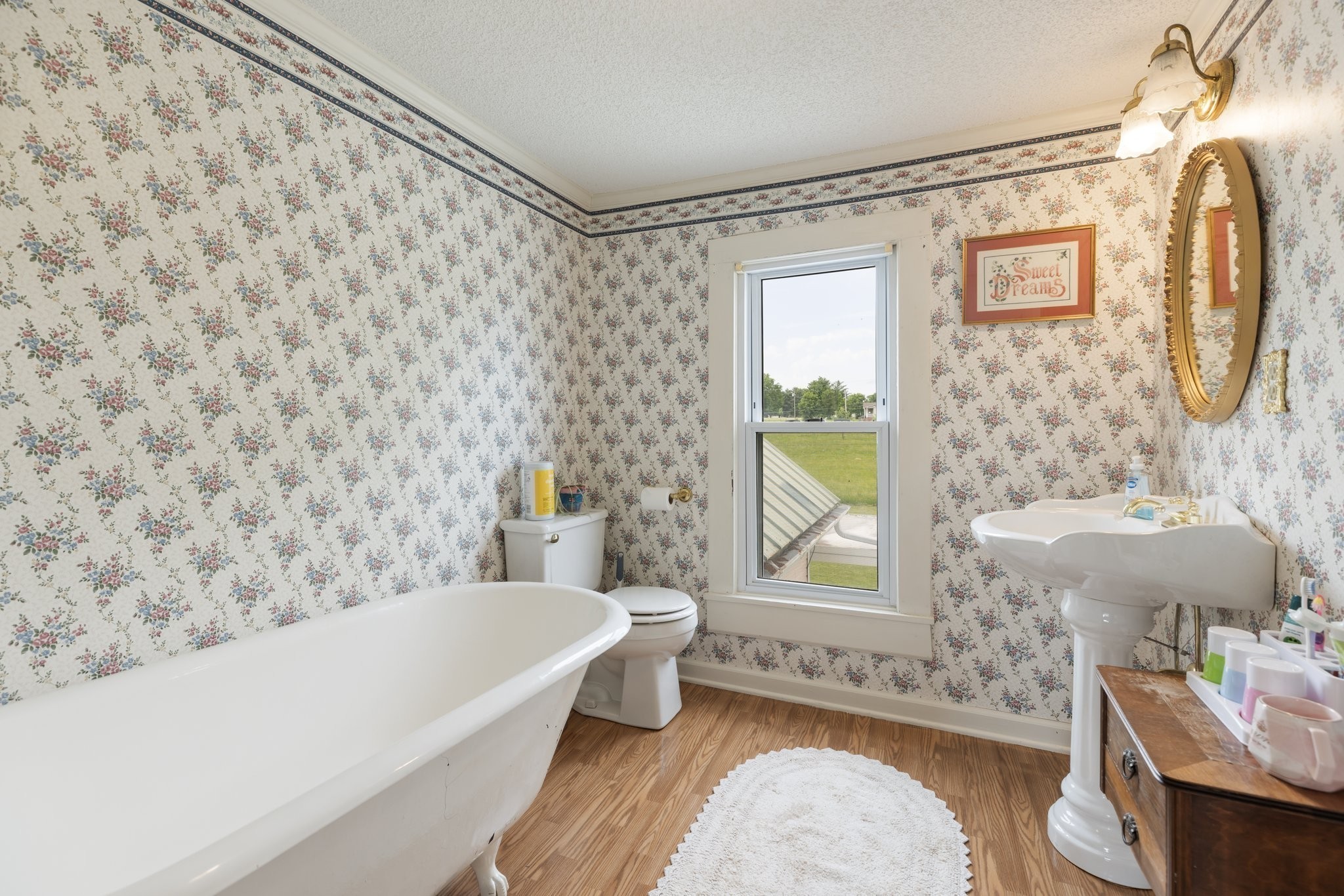 3310 Booker Ridge Road Mount Pleasant, TN 38474 - Photo 29 of 40 a bathroom with a sink and a bathtub